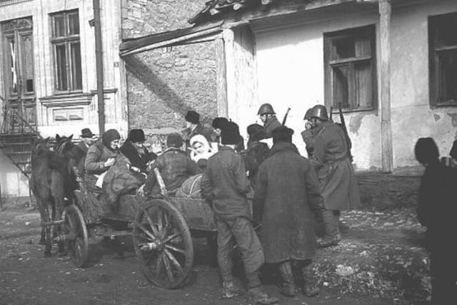   Romanian soldiers supervise the deportation of Jews from Kishinev. Kishinev, Bessarabia, Romania, October 28, 1941. (photo credit: US HOLOCAUST MUSEUM)