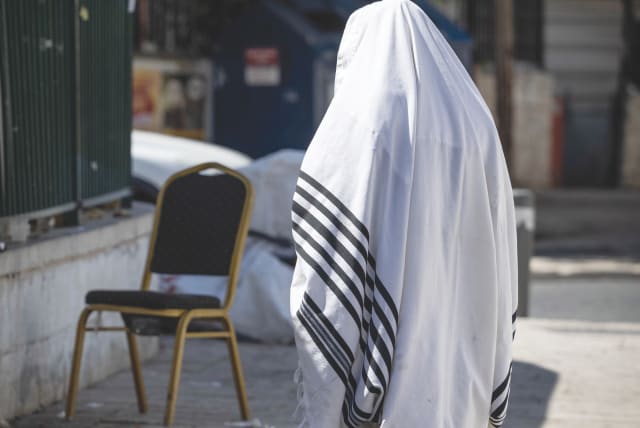  SPLITTING A disputed tallit is a familiar concept in Judaism. The good news is that the subject has always been controversial. The bad news is that the debate has reached a boiling point, says the writer.  (photo credit: CHAIM GOLDBEG/FLASH90)