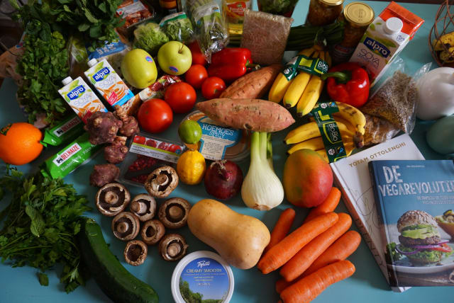  Vegan and vegetarian groceries and cook books. (photo credit: Wikimedia Commons)