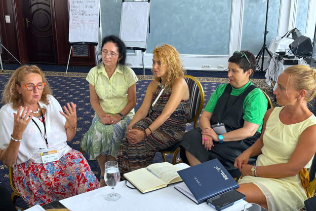  Borka Marinkovic, far left, talks about her experiences as the daughter of Holocaust survivors with a group of Serbian teachers during an August 2023 TOLI education seminar in Šabac, Serbia. (photo credit: LARRY LUXNER/JTA)