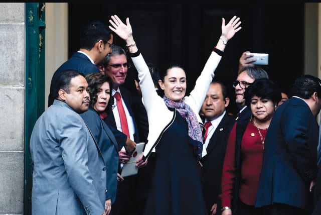  CLAUDIA SHEINBAUM – the first woman elected governor of Mexico City – waves upon her arrival to be sworn in, Dec. 2018 (photo credit: Alfredo Estrella/AFP via Getty Images)
