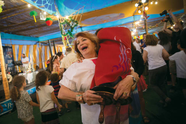  THE JOY of getting close to the Torah (photo credit: MIRIAM ALSTER/FLASH90)