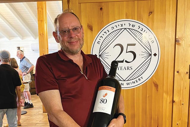  THE WRITER is equipped with a double-magnum size bottle of Dalton ‘Matatia,’ the winery’s flagship wine, on a Kosher Travelers food and wine tour of the Galilee, in April. (photo credit: David M. Weinberg)