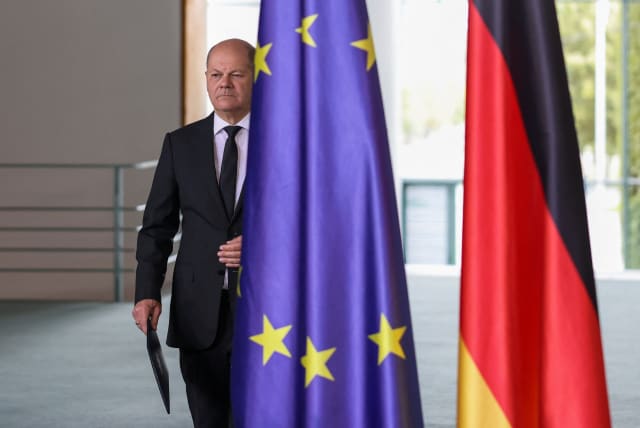  German Chancellor Olaf Scholz walks as he comments on the situation in the Middle East, one day after Hamas' attacks on Israel, in the chancellery, Berlin, Germany, October 8, 2023. (photo credit: REUTERS/Liesa Johannssen)