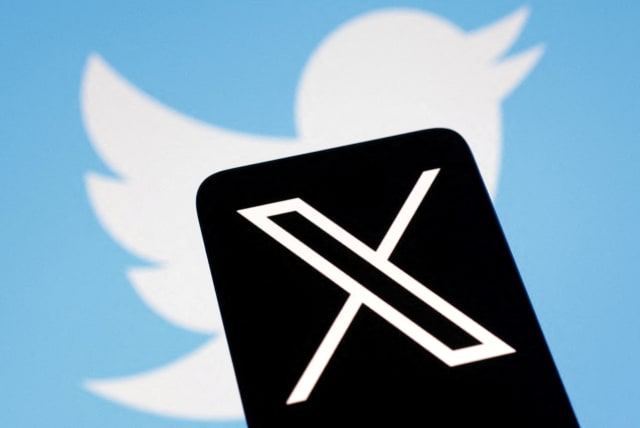  The logo for social media platform X, following the rebranding of Twitter, is seen covering the old logo in this illustration taken, July 24, 2023. (photo credit: REUTERS/DADO RUVIC)