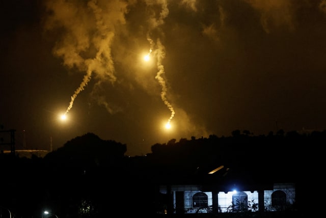  Flares, fired from the Israeli side, burn in the sky as seen from Ramyah near the Lebanese-Israeli border, in southern Lebanon, October 11, 2023 (photo credit: REUTERS/THAIER AL-SUDANI)