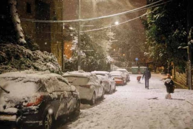  WINTER’S NIGHT: Snow covered streets of Jerusalem, 2021.  (photo credit: OLIVIER FITOUSSI/FLASH90)