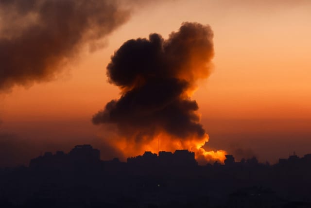 Smoke billows following Israeli strikes amid the ongoing conflict between Israel and the Palestinian Islamist group Hamas, in Gaza, October 13, 2023. (photo credit: REUTERS/MOHAMMED SALEM)