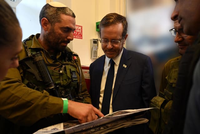  PRESIDENT ISAAC HERZOG receives a military briefing in Sderot. (photo credit: HAIM ZACH/GPO)