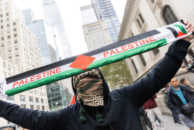  Pro-Palestinian demonstrators protest during the second day of the ongoing conflict between Israel and the Palestinian militant group Hamas, in Manhattan in New York City, U.S., October 8, 2023.  (photo credit: REUTERS/JEENAH MOON)