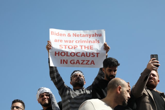 People take part in a pro-Palestinian protest, after hundreds of Palestinians were killed in a blast at Al-Ahli hospital in Gaza that Israeli and Palestinian officials blamed on each other, in Amman, Jordan, October 18, 2023 (photo credit: REUTERS/ALAA AL SUKHNI)