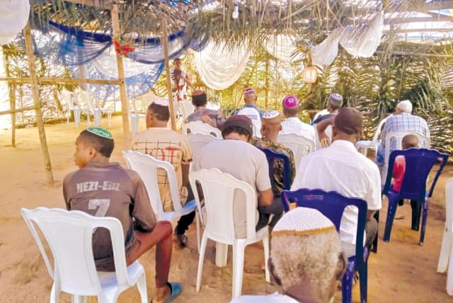  The men’s section in the central sukkah. (photo credit: AVRAHAM BEN AVRAHAM)