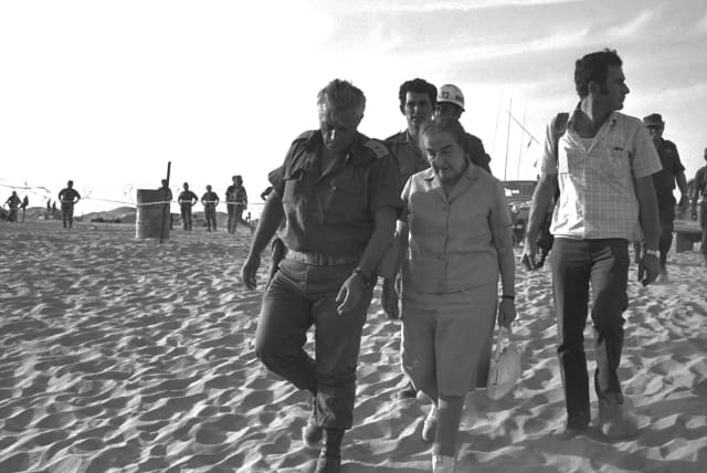  PRIME MINISTER Golda Meir with Maj. Gen. Ariel Sharon in the Sinai Peninsula in Oct. 1973.  (photo credit: Yehuda Tzion/GPO/Handout/Reuters)