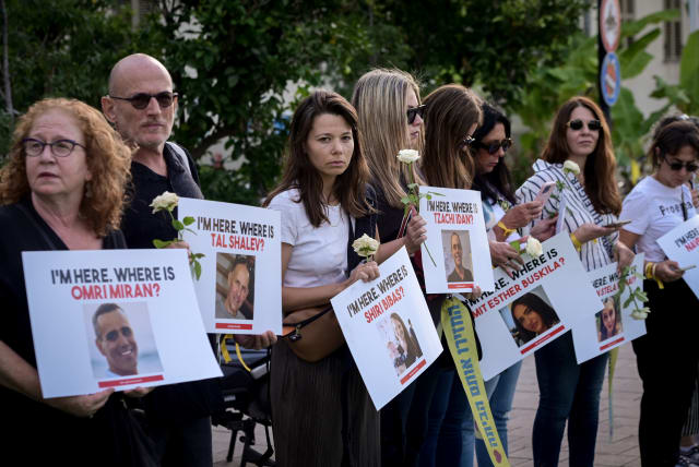  People call on the release of Israelis held hostage by Hamas militants in Gaza, outside the Ministry of Defense in Tel Aviv. October 19, 2023. (photo credit: AVSHALOM SASSONI/FLASH90)
