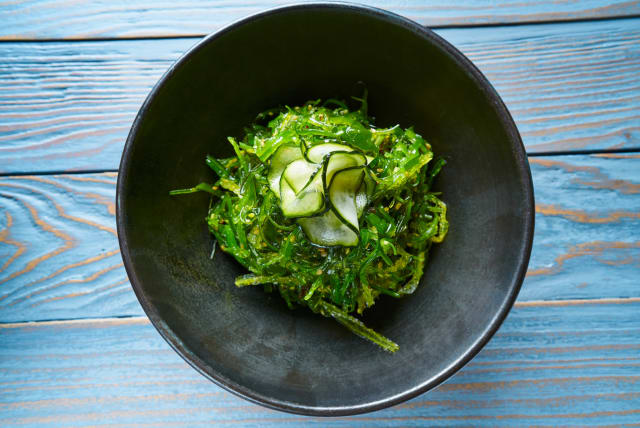  Algae salad with cucumber sesame and soya in black bowl (photo credit: INGIMAGE)