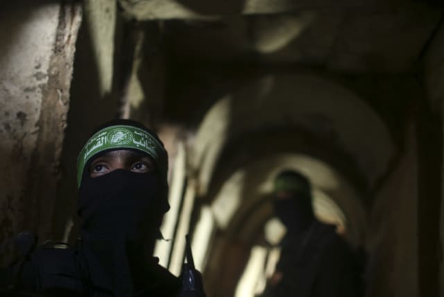  Palestinian terrorists from the Izz el-Deen al-Qassam Brigades, the armed wing of the Hamas movement, stand inside an underground tunnel in Gaza August 18, 2014.  (photo credit: REUTERS/MOHAMMED SALEM)