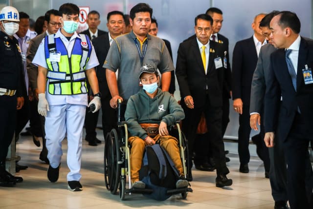  Somma, a migrant agricultural worker who was injured by a surprise attack on Israel by the Palestinian militant group Hamas, arrives at Bangkok's Suvarnabhumi Airport, Thailand, October 12, 2023.  (photo credit: REUTERS/Chalinee Thirasupa)