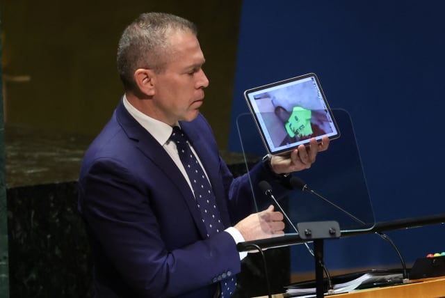  Israel's Ambassador to the United Nations Gilad Erdan shows a video on a portable device as he speaks to an emergency special session of the United Nations General Assembly on the ongoing conflict between Israel and Hamas at U.N. headquarters in New York City, U.S., October 26, 2023. (photo credit: REUTERS/MIKE SEGAR)