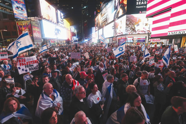  People gather for a demonstration at Times Square to express solidarity with Israel, amid the ongoing conflict between Israel and the Palestinian Islamist group Hamas, in New York City, U.S., October 19, 2023 (photo credit: REUTERS/MIKE SEGAR)