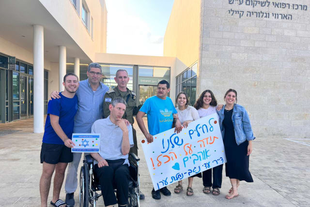  IDF spokesman Brigadier-General Daniel Hagari went to Adi Negev-Nahalat Eran in the Eshkol region to visit his very-disabled brother, Yoni, who was one of the first residents of the village. (photo credit: Adi Negev-Nahalat Eran)