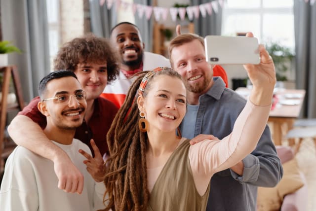  Friends taking a selfie together (photo credit: PEXELS)