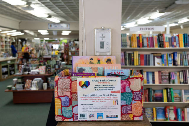  Books that have been donated to the "Read with Love Book Drive" run by PFLAG Bucks County to help place LGBTQ+ books in Bucks and Montgomery County libraries are placed in a donation box at the Doylestown Bookshop in Doylestown, Pennsylvania, U.S., April 7, 2023. (photo credit: REUTERS/HANNAH BEIER)
