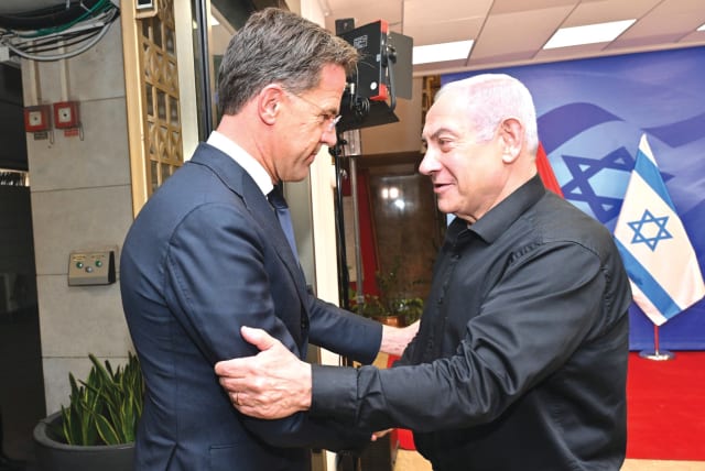  PRIME MINISTER Benjamin Netanyahu in his black attire with Dutch Prime Minister Mark Rutte. (photo credit: KOBI GIDEON/GPO)
