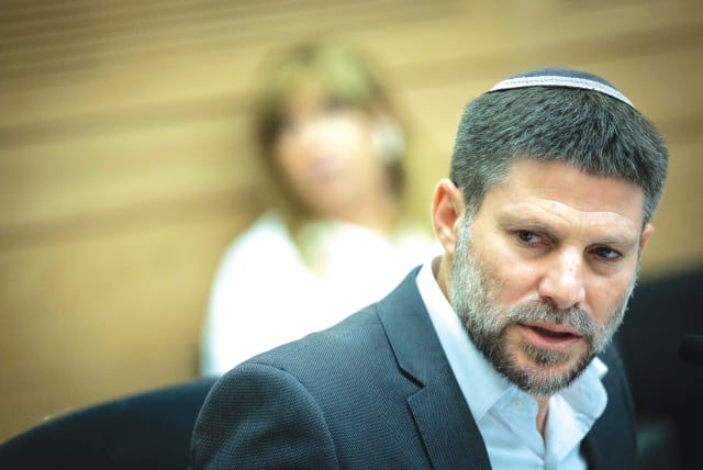  FINANCE MINISTER Bezalel Smotrich attends a discussion on the state budget, at the Knesset Finance Committee, in July. The state budget for 2024 and the next few years must be fundamentally redrafted, say the writers.  (photo credit: YONATAN SINDEL/FLASH 90)