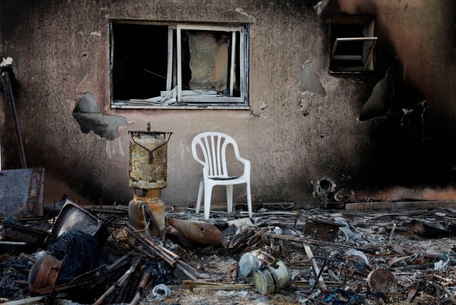  A view shows a destroyed home riddled with bullets, following the deadly October 7 attack by Hamas gunmen from the Gaza Strip, in Kibbutz Kfar Aza, southern Israel November 2, 2023.  (photo credit: EVELYN HOCKSTEIN/REUTERS)