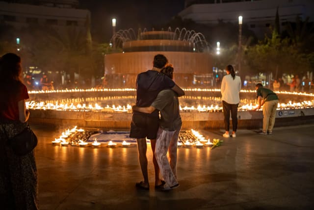  People gather and light candles to remember the Israeli victims of the October 7 massacre at Dizengoff Square in Tel Aviv, October 12, 2023.  (photo credit: Dor Pazuelo/Flash90)