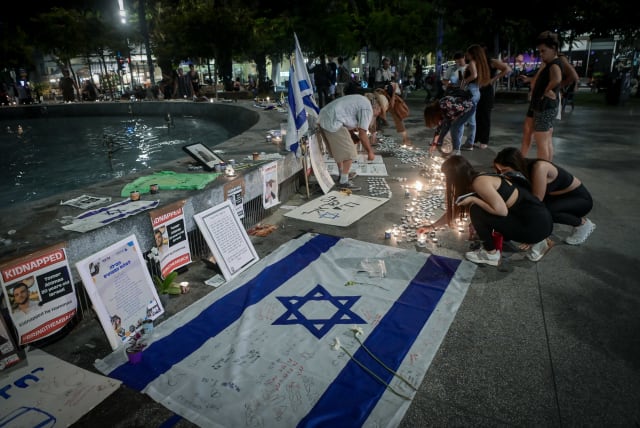  People gather and light candles to remember the victims who were murdered by Hamas terrorists and to remember the people abducted by Hamas terrorists at Dizengoff Square in Tel Aviv, November 5, 2023.  (photo credit: AVSHALOM SASSONI/FLASH90)