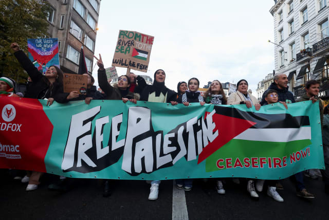 People take part in a protest in support of Palestinians in Gaza, as the conflict between Israel and Palestinian terrorist group Hamas continues, in Brussels, Belgium, November 11, 2023.  (photo credit: YVES HERMAN/REUTERS)
