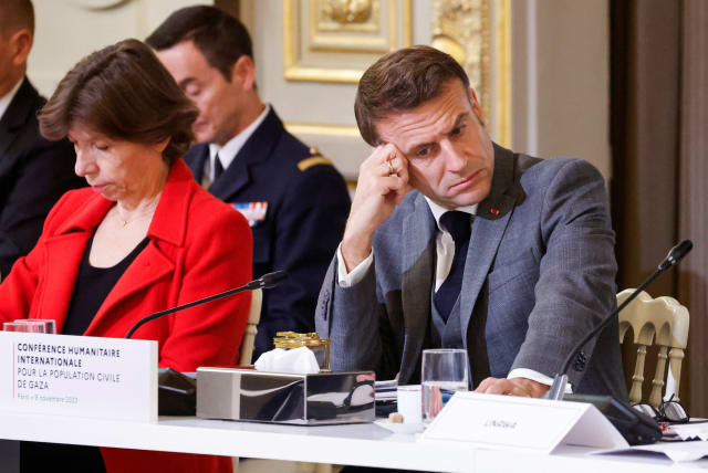  French President Emmanuel Macron looks down next to French Foreign and European Affairs Minister Catherine Colonna during an international humanitarian conference for civilians in Gaza, at the Elysee Presidential Palace, in Paris, France, on November 9, 2023. (photo credit: LUDOVIC MARIN/POOL VIA REUTERS)