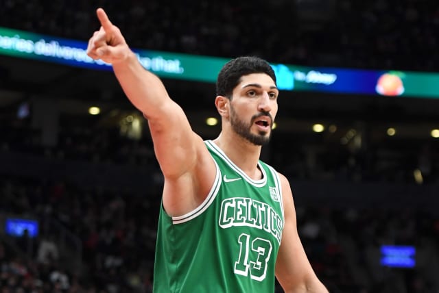 Former Boston Celtics center Enes Kanter Freedom gestures as he reacts to an officials call against Toronto Raptors in the second half at Scotiabank Arena. Nov 28, 2021. (photo credit: DAN HAMILTON-USA TODAY SPORTS)