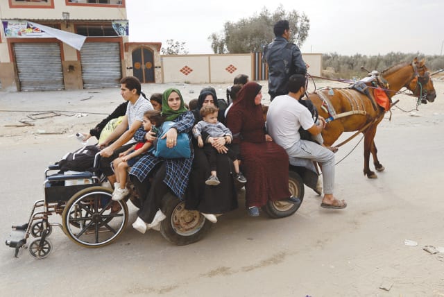  PALESTINIANS FLEE northern Gaza on a horse-drawn cart this week. ‘You’re stuck. Gazans have nowhere to run. No one in the Arab world wants you,’ argues the writer.  (photo credit: IBRAHEEM ABU MUSTAFA/REUTERS)