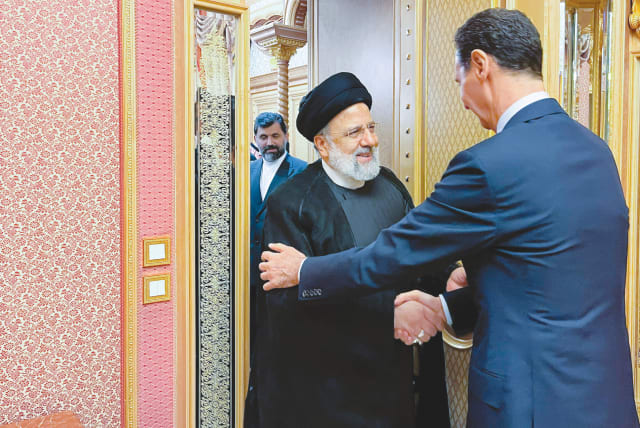  IRANIAN PRESIDENT Ebrahim Raisi meets with Syria’s President Bashar Assad at an Organization of Islamic Cooperation summit in Riyadh, this past Saturday. (photo credit: Iran’s Presidency/West Asia News Agency/Reuters)