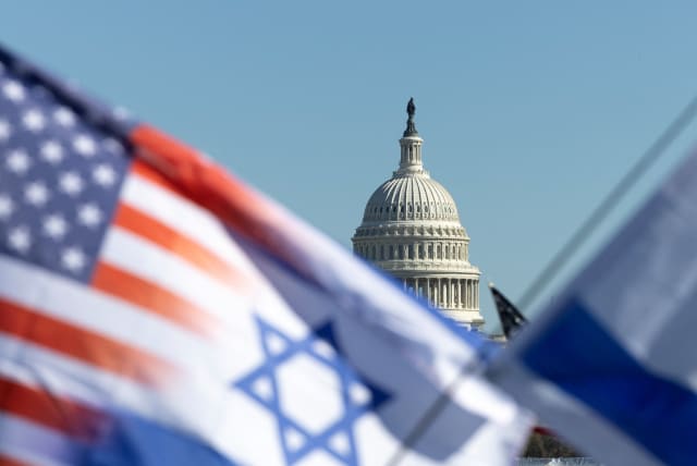  Israel and American flags are flown near the US Capitol during a rally in support of Israel and protest against antisemitism on the National Mall in Washington, November 14, 2023. (photo credit: TOM BRENNER/REUTERS)