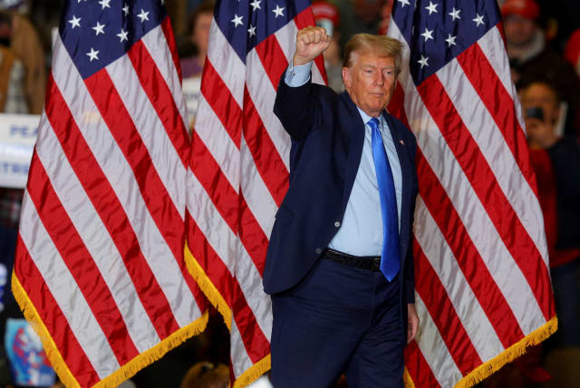 FILE PHOTO: Republican presidential candidate and former U.S. President Donald Trump gestures during a campaign rally in Claremont, New Hampshire, U.S., November 11, 2023. (photo credit: REUTERS/BRIAN SNYDER/FILE PHOTO)