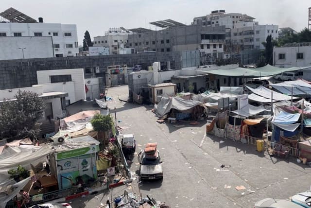  Tents and shelters used by displaced Palestinians stand at the yard of Al Shifa hospital during the Israeli ground operation around the hospital, in Gaza City November 12, 2023 (photo credit: AHMED EL MOKHALLALATI/VIA REUTERS)