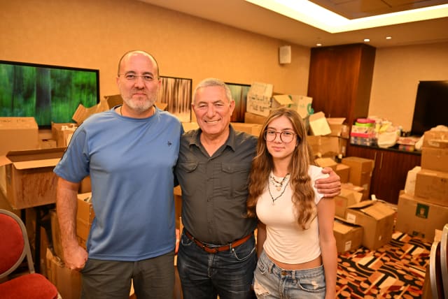  Chair of The Jewish Agency (center) Maj. Gen. (res.) Doron Almog with Rami (left) and Ella (right) Bar-Gil (photo credit: THE JEWISH AGENCY)
