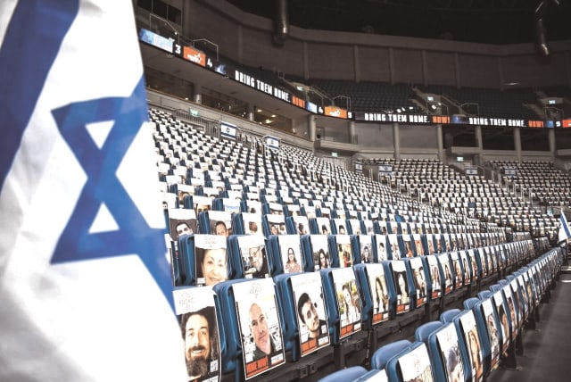  HAPOEL JERUSALEM’S Pais Arena in the capital had pictures of the hostages taken by Hamas on all the lower-bowl seats for Wednesday’s viewing event for their families. (photo credit: YEHUDA HALICKMAN)