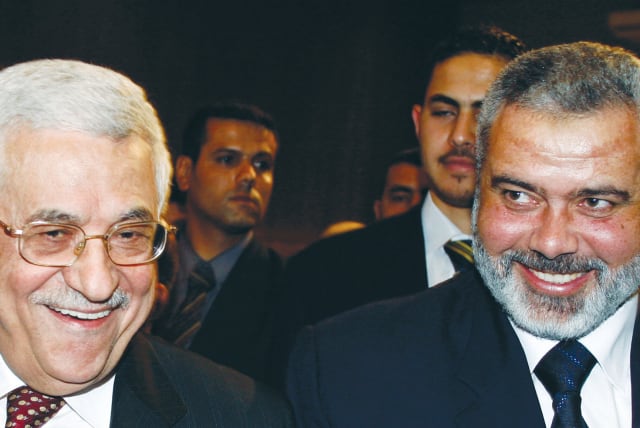  PA head Mahmoud Abbas of Fatah and then-prime minister Ismail Haniyeh of Hamas in the Palestinian Legislative Council, in March 2007, just before the Hamas coup in the Gaza Strip in June: Fatah and Hamas collaborated during the Second Intifada. (photo credit: SUHAIB SALEM/REUTERS)