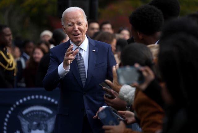  U.S. President Joe Biden greets the audience after he pardoned the National Thanksgiving Turkeys during the annual ceremony on the South Lawn at the White House in Washington, U.S., November 20, 2023. (photo credit: REUTERS/LEAH MILLIS)