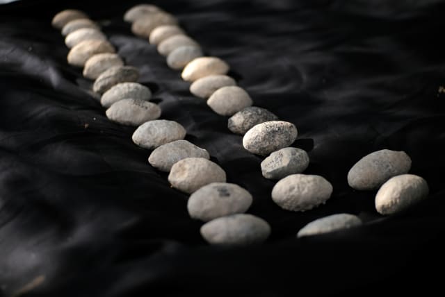  The ancient slingstones: the earliest evidence for warfare in the region (photo credit: EMIL ALADJEM/ISRAEL ANTIQUITIES AUTHORITY)