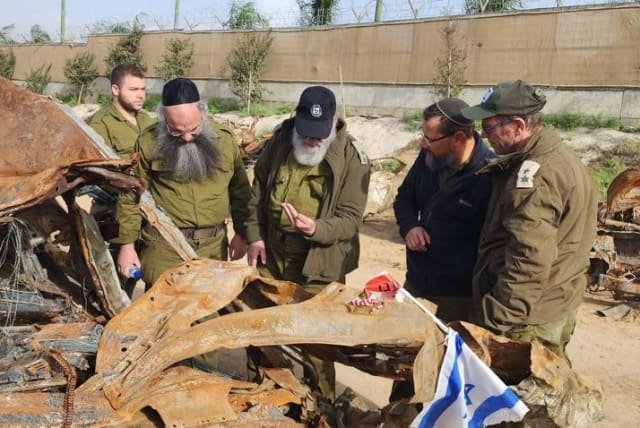  Rabbi Yaakov Rose of ZAKA Tel Aviv examining the cars with remains in southern Israel (photo credit: Zaka Tel Aviv)