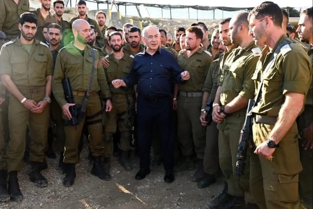 He will persist in misleading the public as usual. Prime Minister Benjamin Netanyahu is seen with IDF forces during the course of the war (photo credit: CHAIM TZACH/GPO)