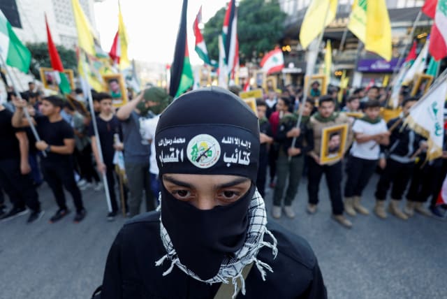  Lebanese Hezbollah supporters attend a protest in support of Palestinians in Gaza, amid the ongoing conflict between Israel and the Palestinian Islamist group Hamas, in Nabatieh, southern Lebanon November 18, 2023 (photo credit: REUTERS/ALAA AL-MARJANI)