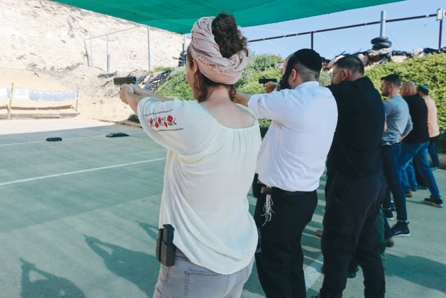  CALIBER 3 shooting range in Gush Etzion, earlier this month: Over the past month, more than 200,000 Israelis have filed applications for gun licenses.  (photo credit: MARC ISRAEL SELLEM/THE JERUSALEM POST)