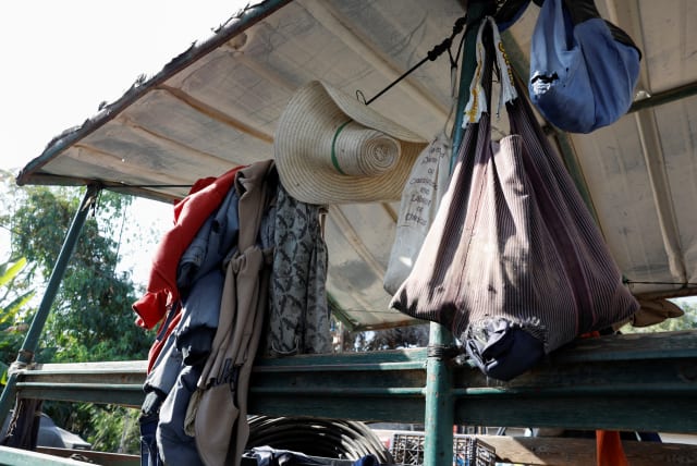  The clothes of Thai workers, many of who were killed or kidnapped, hang outside a destroyed home, following the deadly Oct. 7 attack by Hamas terrorists from the Gaza Strip, in Kibbutz Kissufim, southern Israel November 1, 2023.  (photo credit: REUTERS/EVELYN HOCKSTEIN)