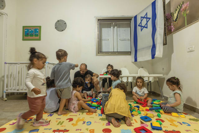  SMALL CHILDREN play at a kindergarten inside a bomb shelter in central Israel earlier this month.  (photo credit: YOSSI ALONI/FLASH90)